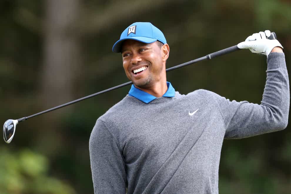 Tiger Woods smiling in action