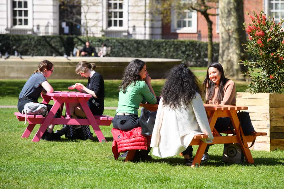 People sit in Grosvenor Square