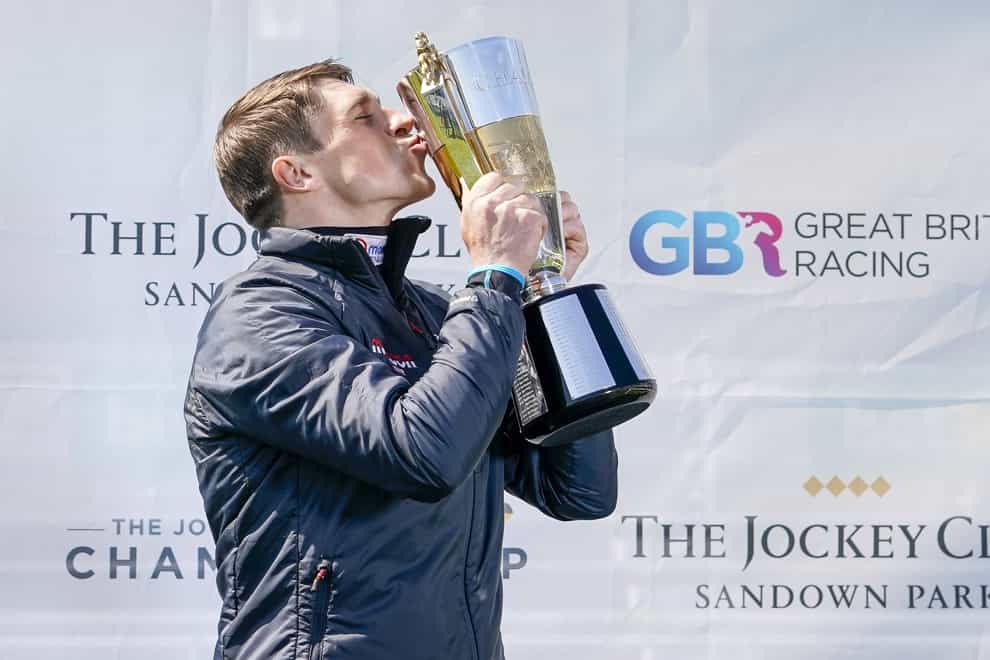 Harry Skelton celebrates with his champion Jockey trophy