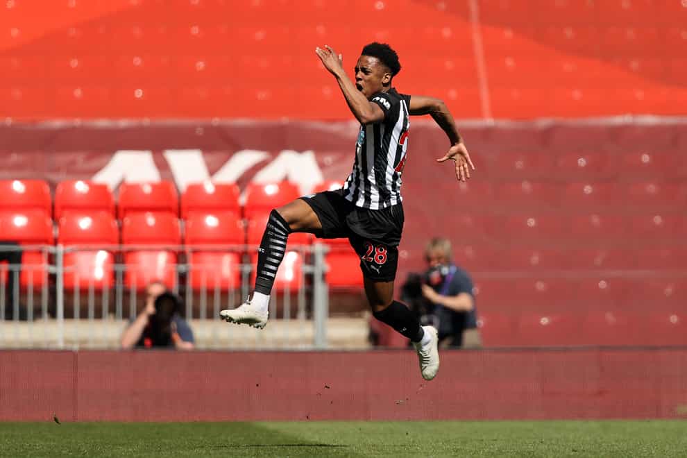 Joe Willock celebrates after scoring Newcastle's late equaliser against Liverpool