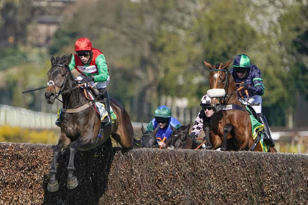 Enrilo (left) jumping the final fence in the bet365 Gold Cup