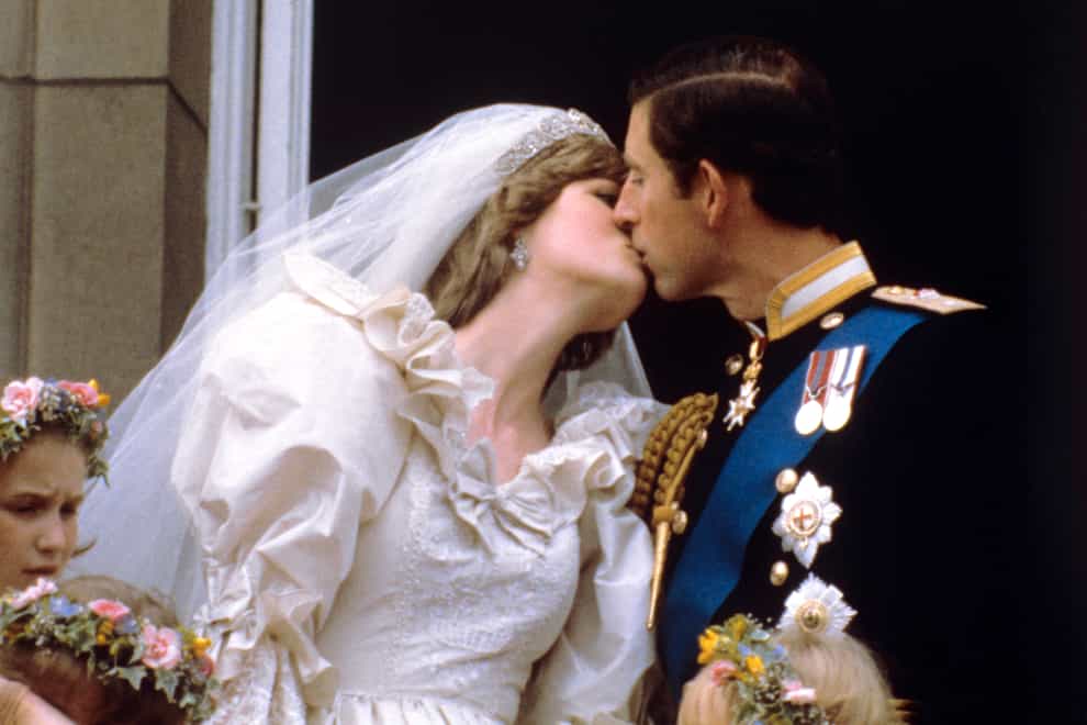 Diana kisses Charles on their wedding day
