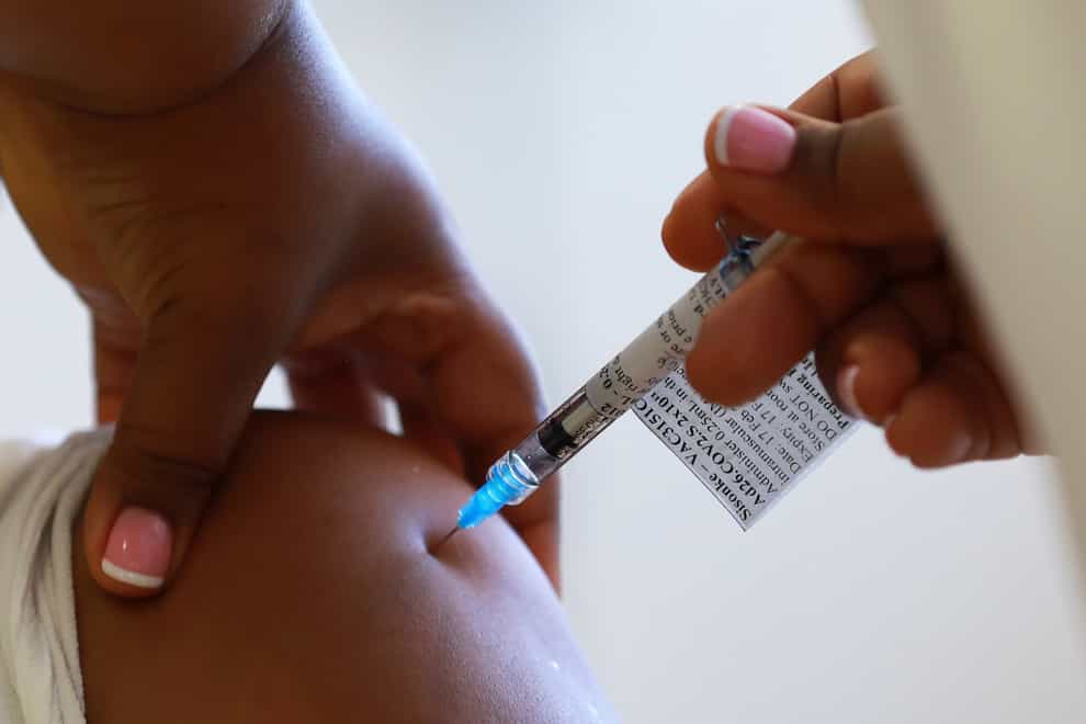 A health care worker receives a vaccine at a hospital in Khayelitsha, Cape Town, South Africa (Nardus Engelbrecht/AP)