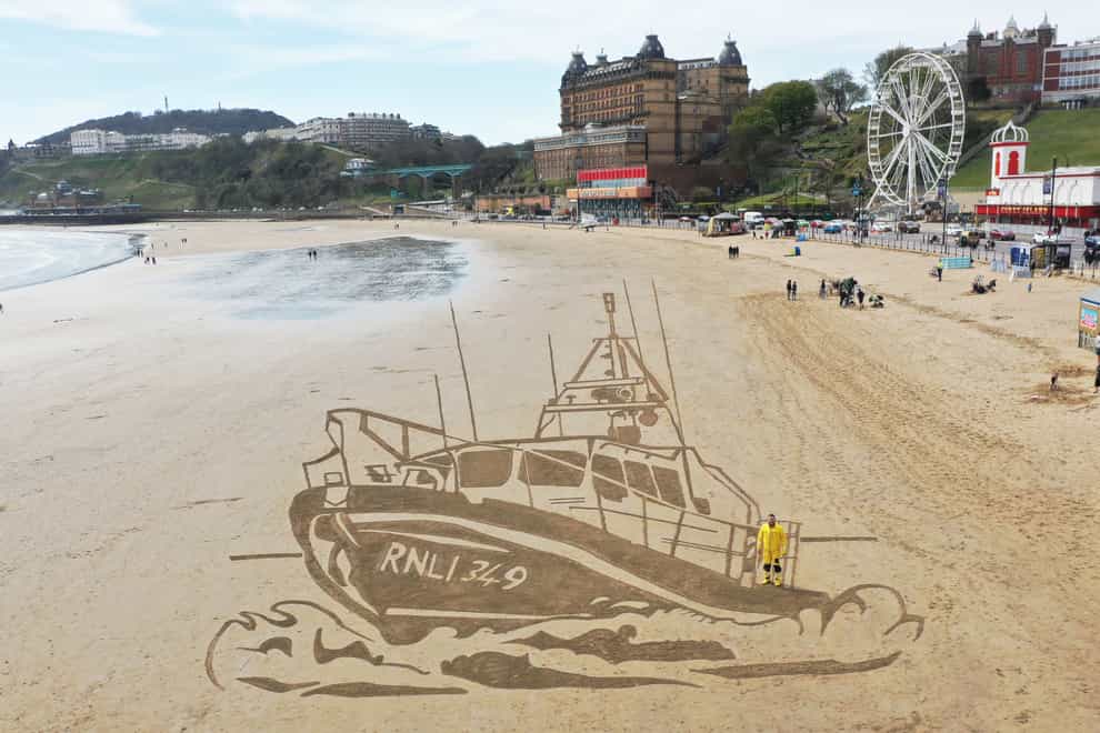 RNLI boat drawn in sand