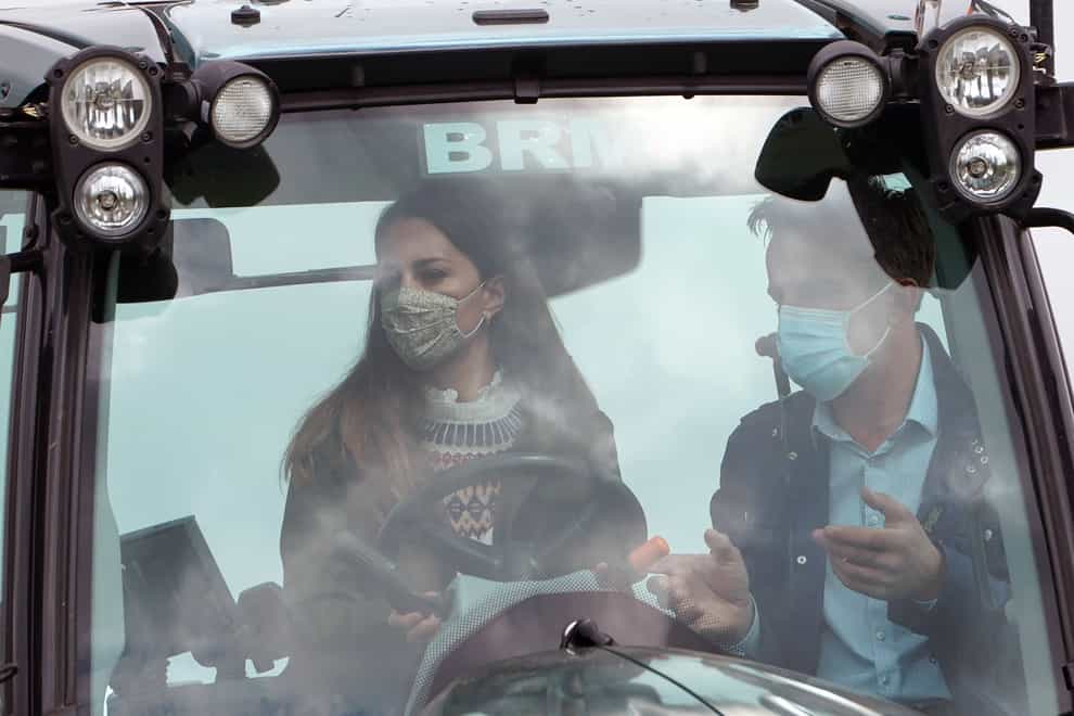 Kate driving a tractor