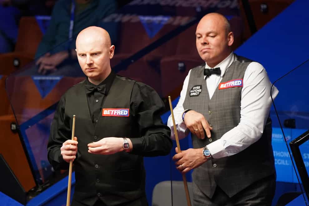 Anthony McGill, left, is ahead of Stuart Bingham going into the final session of their quarter-final in Sheffield