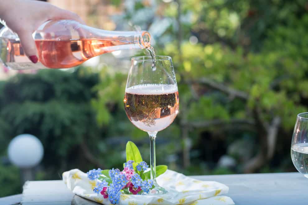 Pouring a glass of rose wine in the sunshine