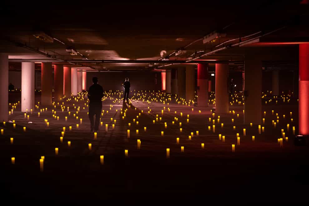 Battery-powered candles light the opera event in an underground car park in Chicago