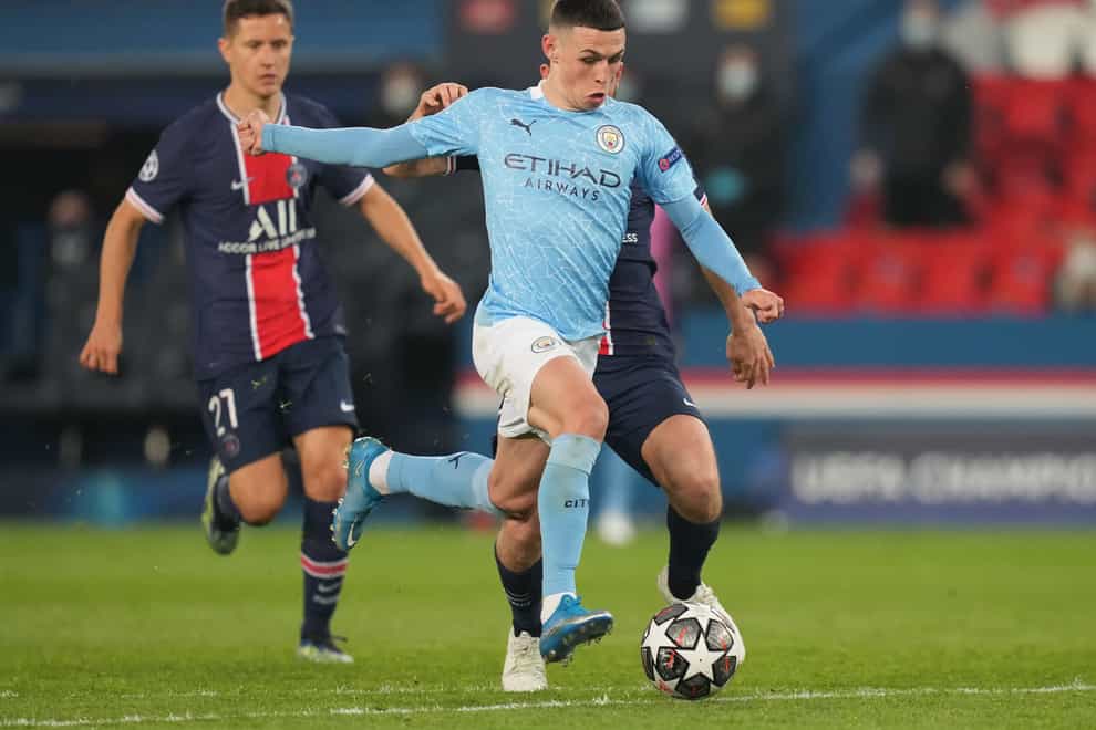 Manchester City’s Phil Foden (centre) in action with Paris Saint-Germain’s Alessandro Florenzi (right) during the UEFA Champions League Semi Final, first leg, at the Parc des Princes