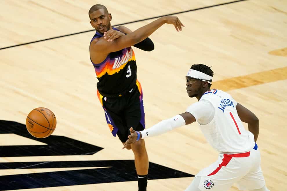Phoenix Suns guard Chris Paul (centre) and Los Angeles Clippers guard Reggie Jackson