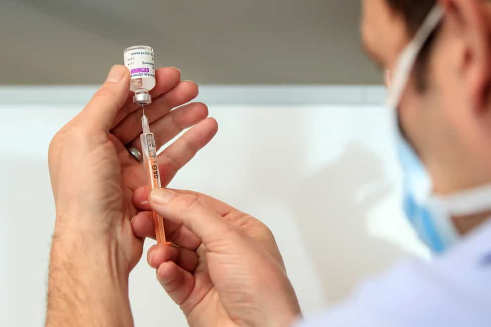 A medic prepares a coronavirus vaccine