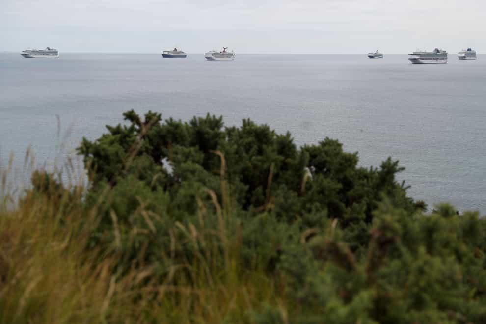 Cruise ships off Portland, Dorset amid a coronavirus-inspired slump in demand (Andrew Matthews/PA)