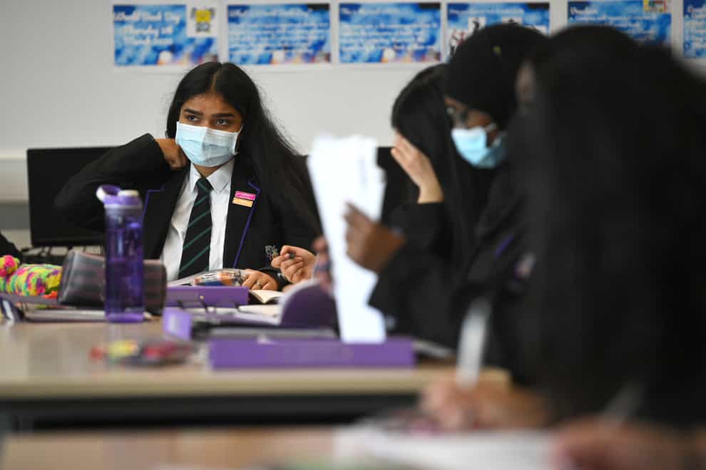 Children wearing facemasks during a lesson at Hounslow Kingsley Academy in West London (Kirsty O'Connor/PA)