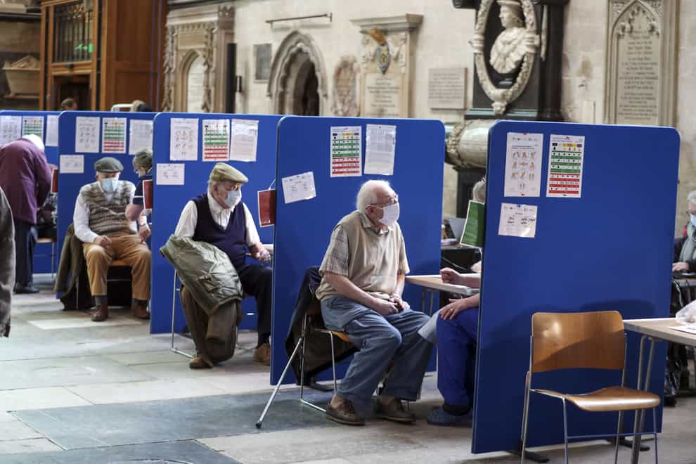 Members of the public receive an injection of the coronavirus vaccine at Salisbury Cathedral, Wiltshire