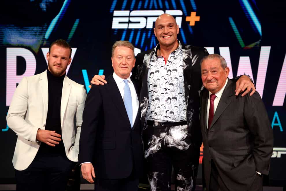 Bob Arum (right) does not believe Tyson Fury (second right) will fight Anthony Joshua this summer