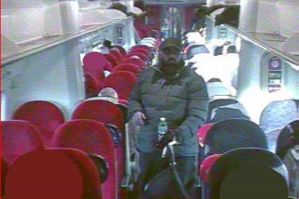 Usman Khan on board a train to London (CCTV/Metropolitan Police/PA)