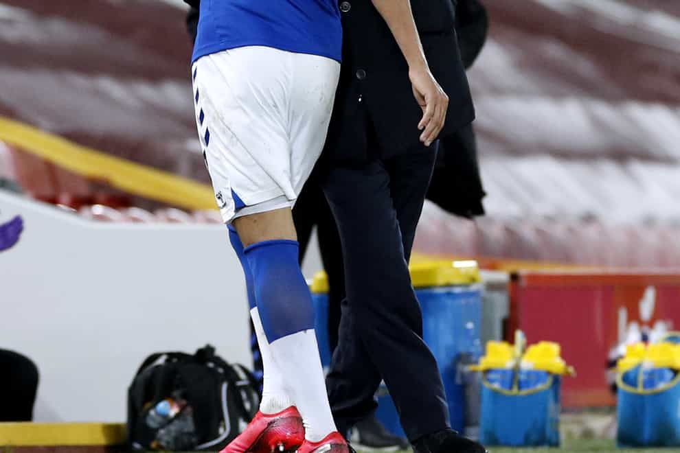 Everton manager Carlo Ancelotti, right, hugs Richarlison