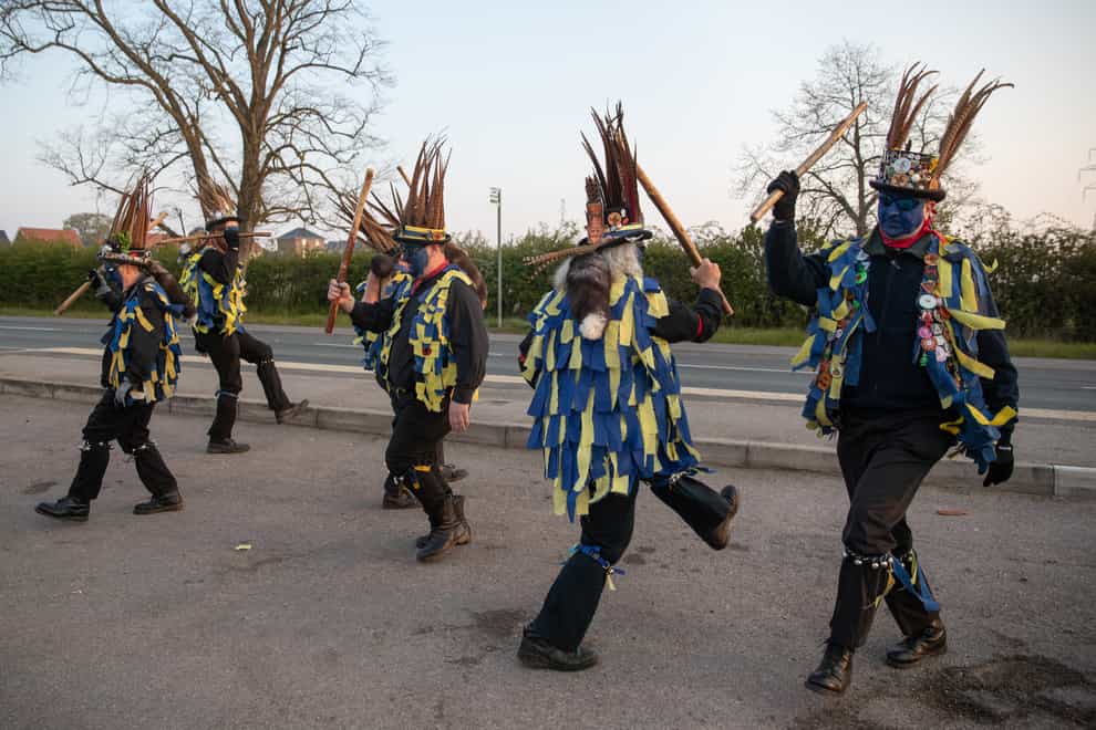 Members of the Hook Eagle Morris Men perform outside the Shack Cafe near to Hook in Hampshire