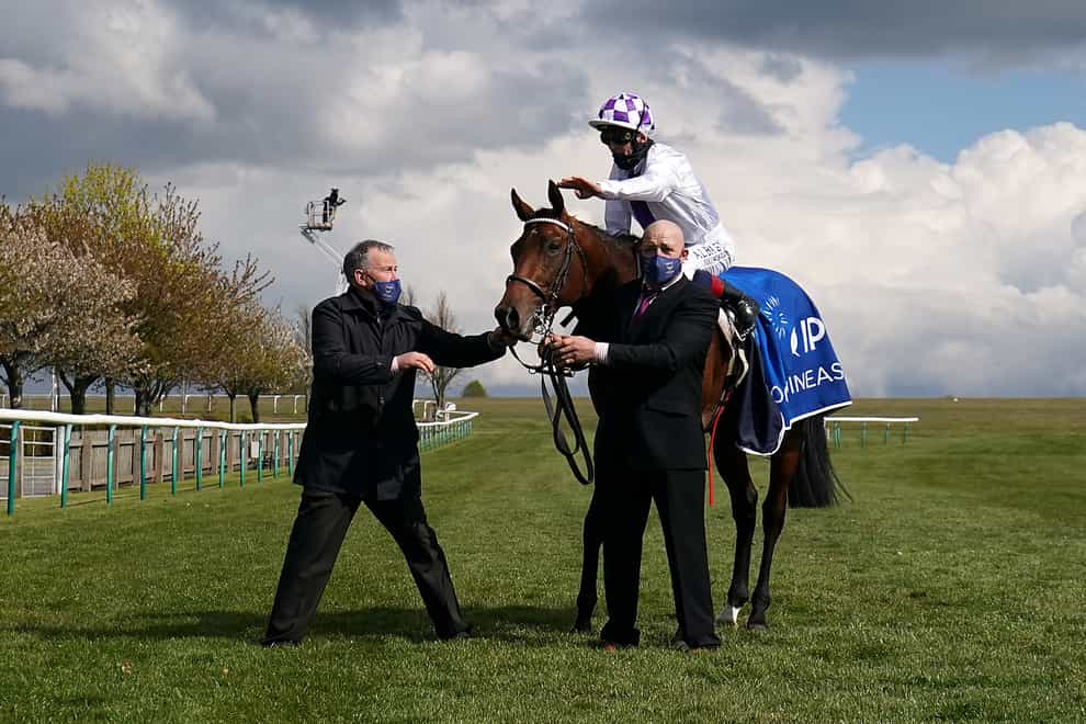 Jockey Kevin Manning celebrates winning the Qipco 2000 Guineas on Poetic Flare