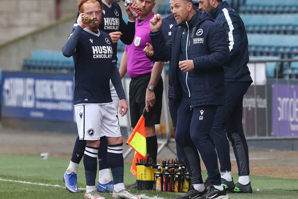Gary Rowett, right, speaks to his team in front of an empty stand