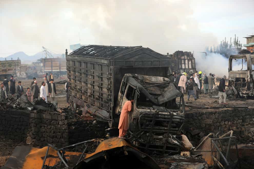 A damaged truck that caught fire in Kabul, Afghanistan
