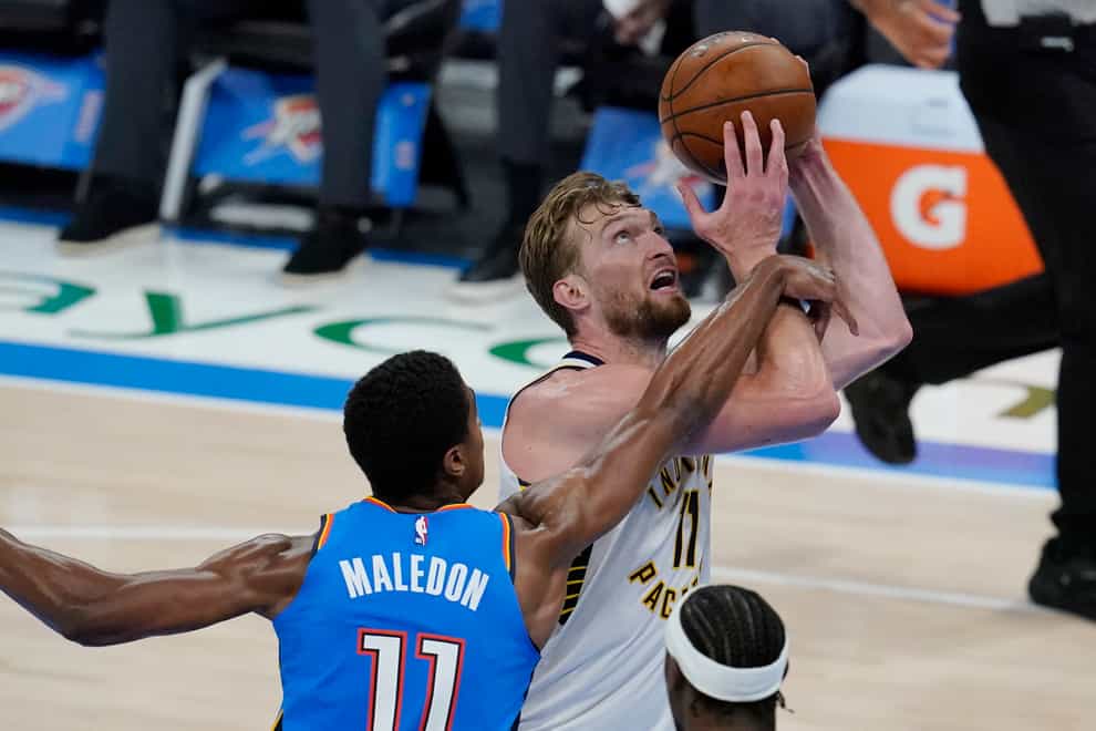 Indiana Pacers forward Domantas Sabonis is fouled by Oklahoma City Thunder guard Theo Maledon