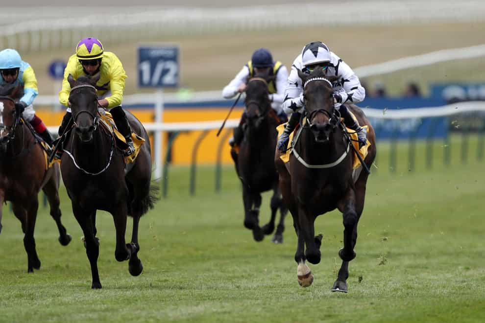 Mystery Angel (right) takes the Betfair Pretty Polly Stakes in the hands of Ben Curtis