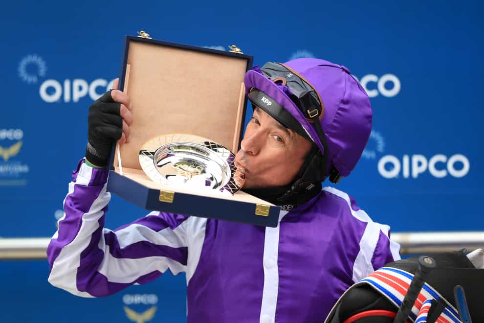 Frankie Dettori kisses the trophy after winning the Qipco 1000 Guineas