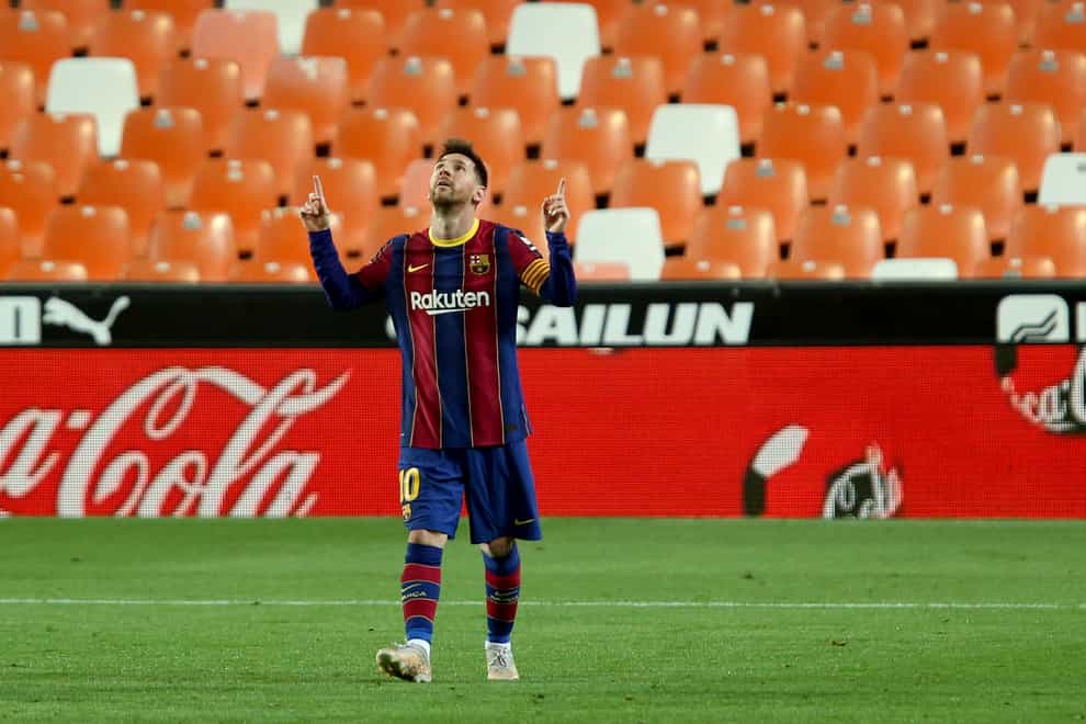 Barcelona’s Lionel Messi celebrates scoring against Valencia