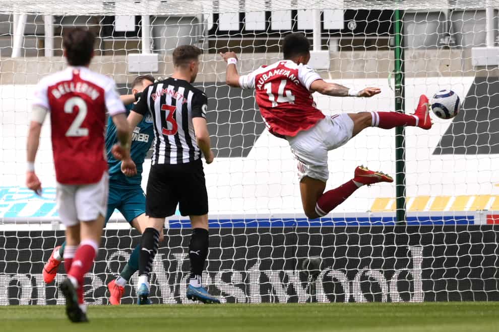 Arsenal’s Pierre-Emerick Aubameyang (right) scores at Newcastle on his return to the starting line-up