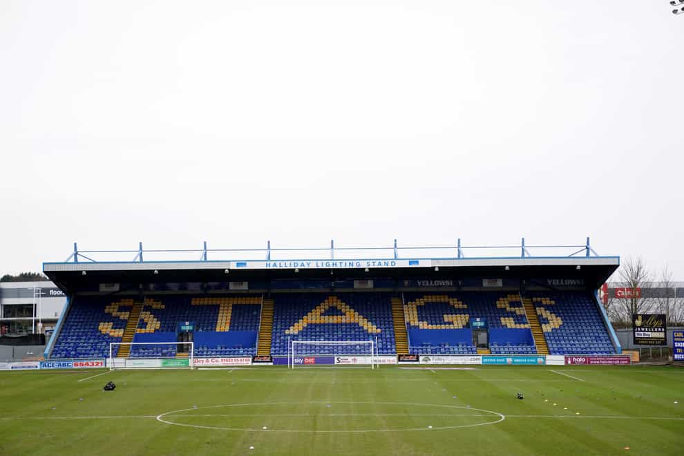 Mansfield have signed three academy players to professional deals