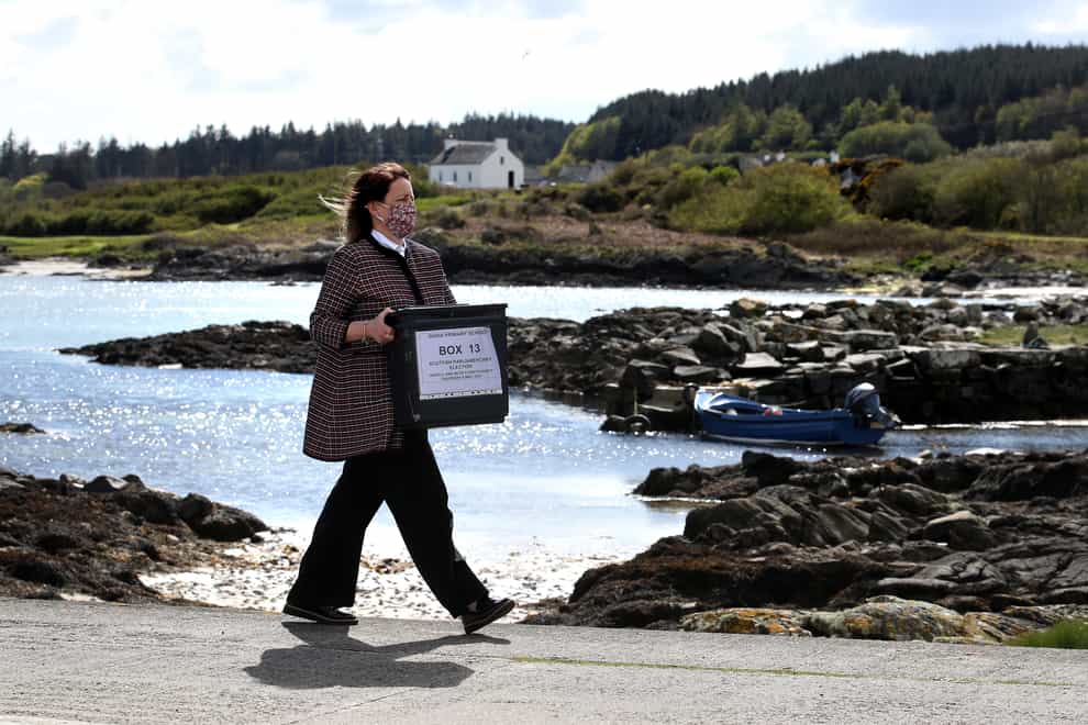 Woman carries ballot box