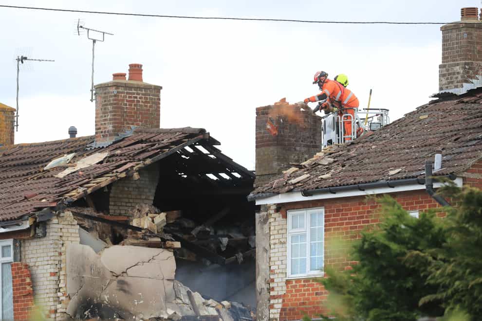 Firefighters inspect damage to a property in Mill View in Willesborough, near Ashford, Kent (Gareth Fuller/PA)