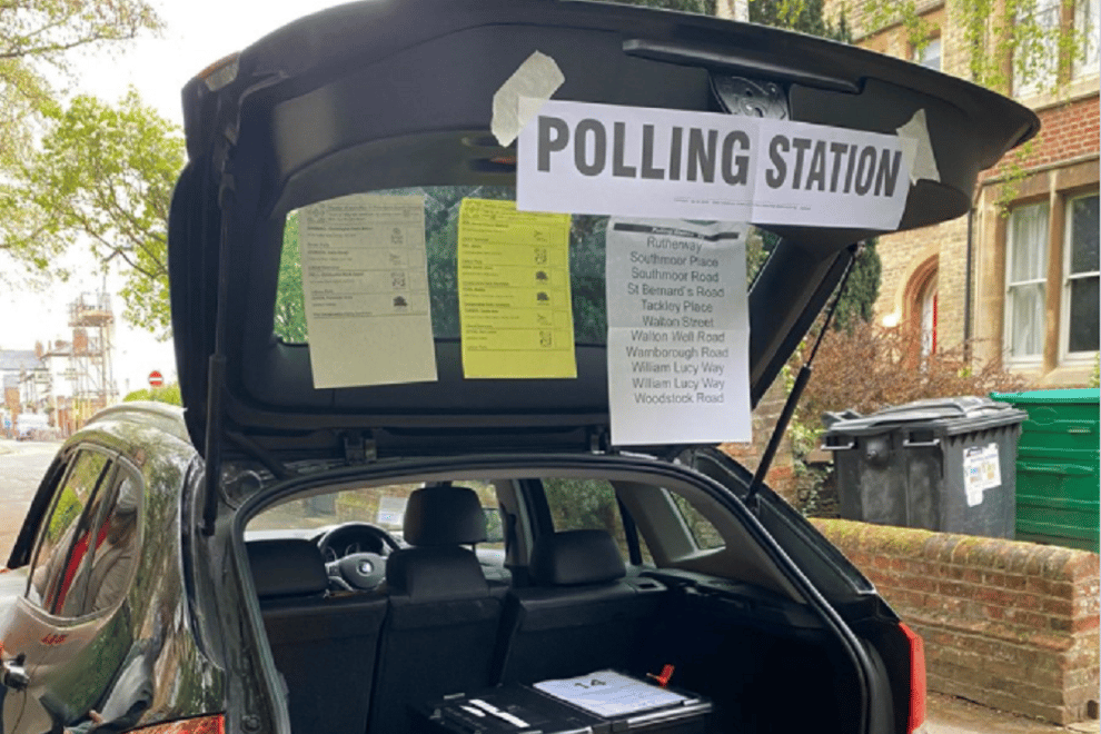 Temporary polling station in a car boot