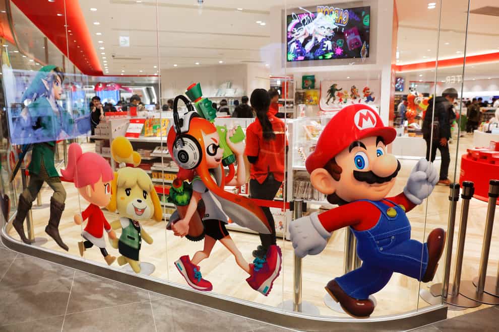 Nintendo characters, including Mario, on the window of it store in Tokyo