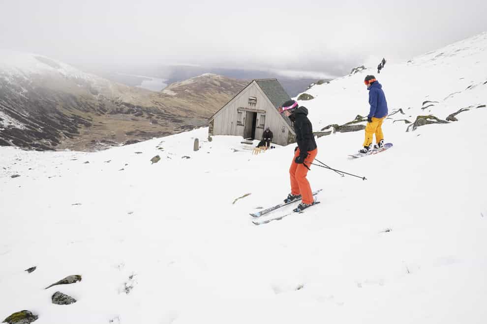 Skiers and snowboarders on Raise, near Helvellyn