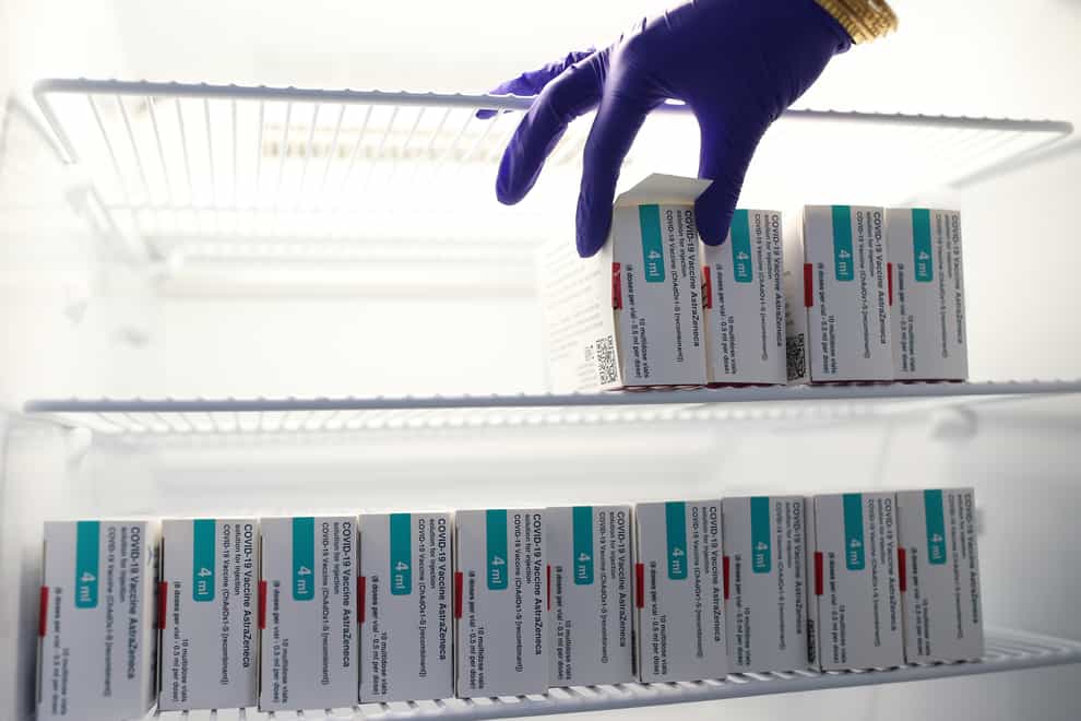 Vials of the Oxford/AstraZeneca coronavirus vaccine are stored in a temperature-controlled fridge (Yui Mok/PA)