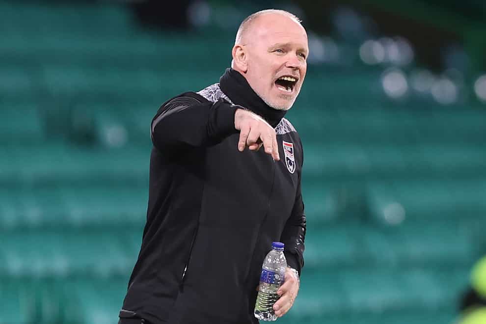 Ross County manager John Hughes on the touchline