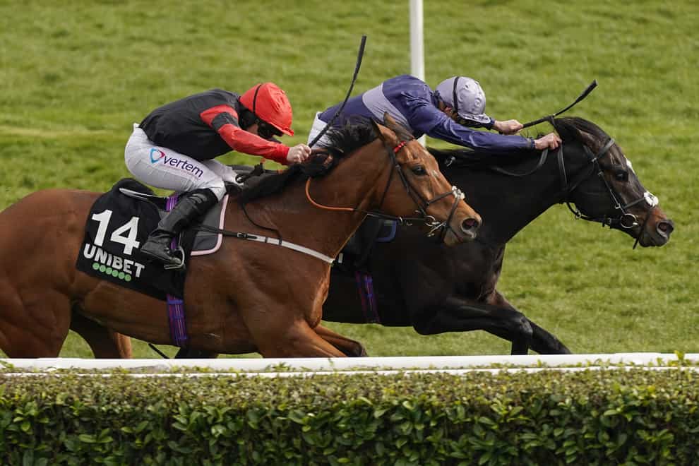 Acquitted (right) in the Unibet Spring Mile Handicap at Doncaster Racecourse