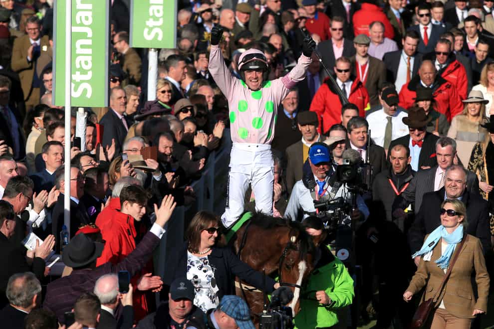 Ruby Walsh celebrates winning the Champion Hurdle with Faugheen