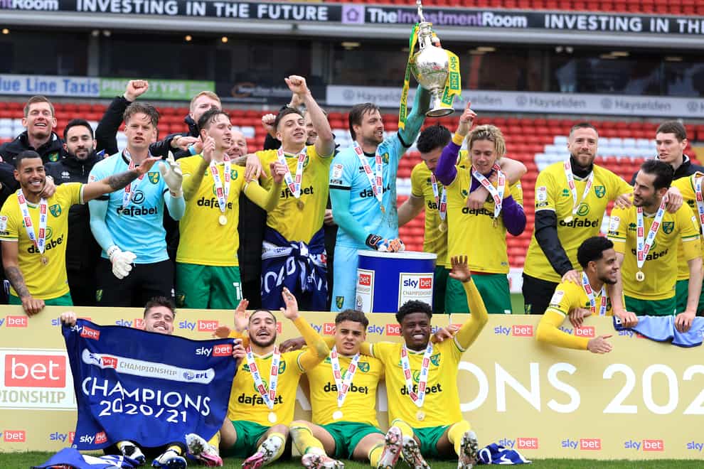 Norwich celebrate with the trophy after winning the Sky Bet Championship