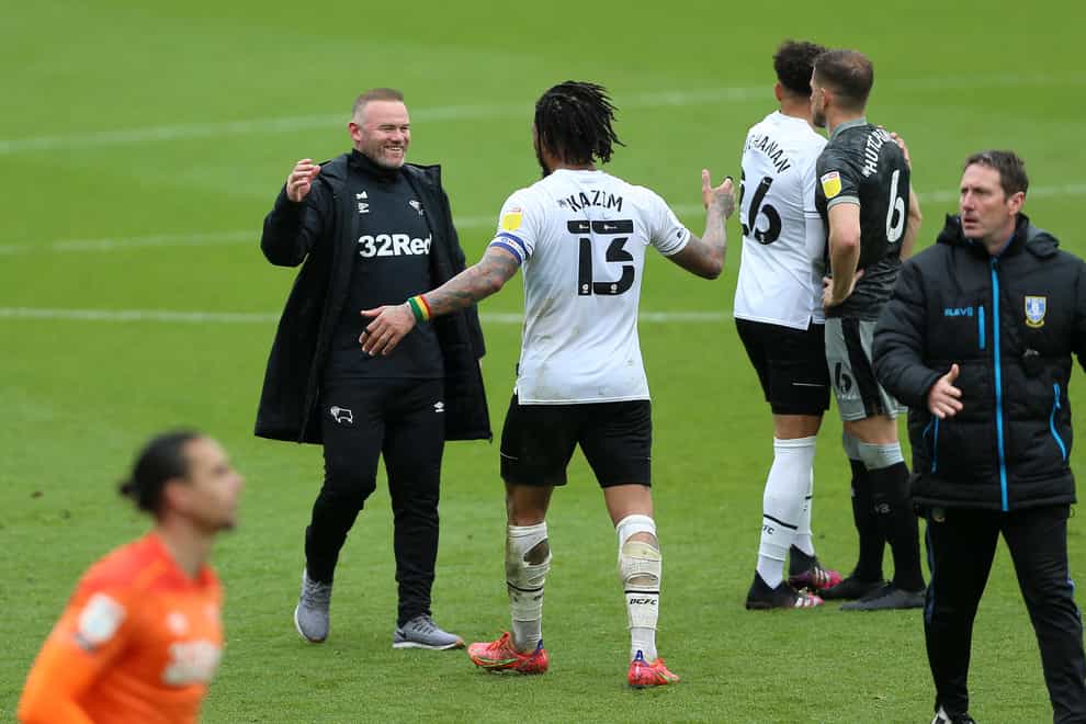 Derby manager Wayne Rooney, left, celebrates with Colin Kazim-Richards