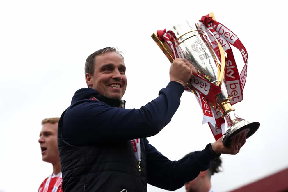 Michael Duff celebrates with the League Two trophy