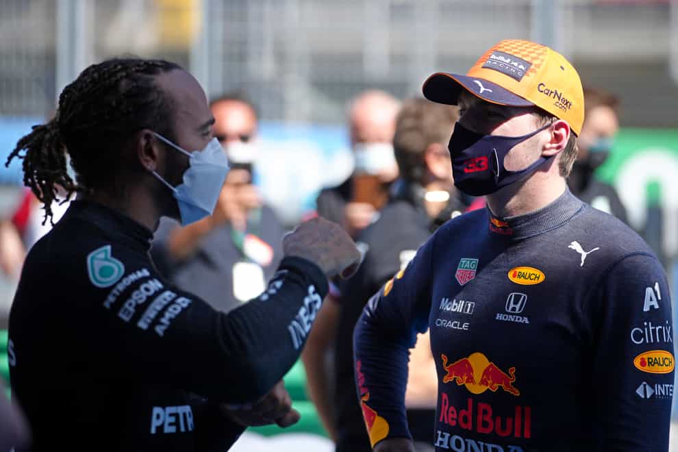 Lewis Hamilton (left) talks with Max Verstappen after qualifying