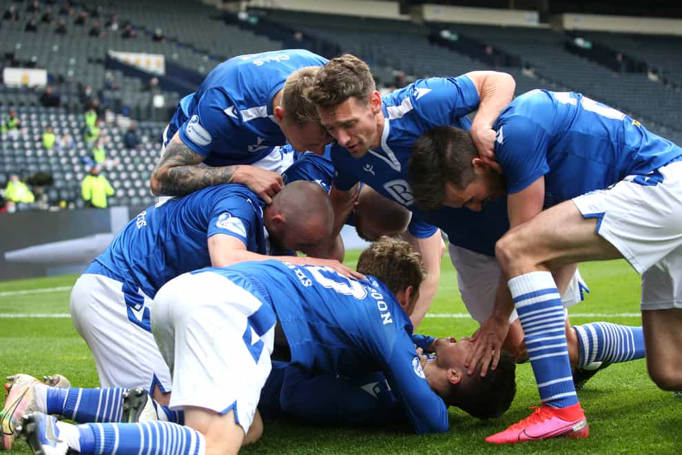 Glenn Middleton celebrates with team-mates after scoring his side's second goal of the game