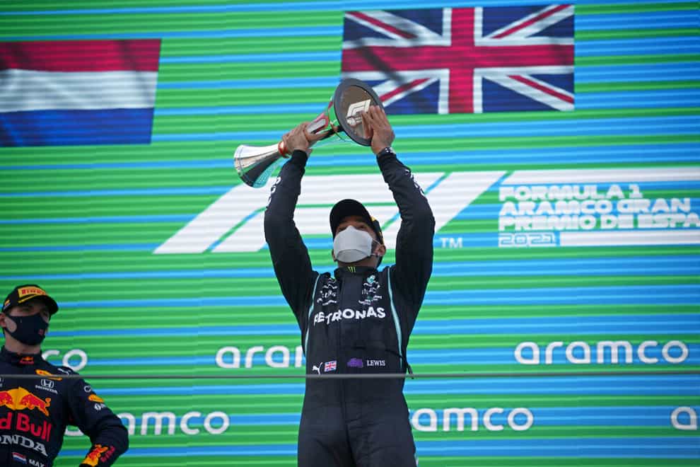 Lewis Hamilton celebrates on the podium after winning the Spanish Grand Prix