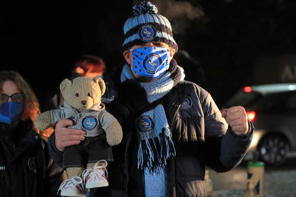 Wycombe fan Colin Pocock - and his teddy - attend the team's match against Stoke on December 2