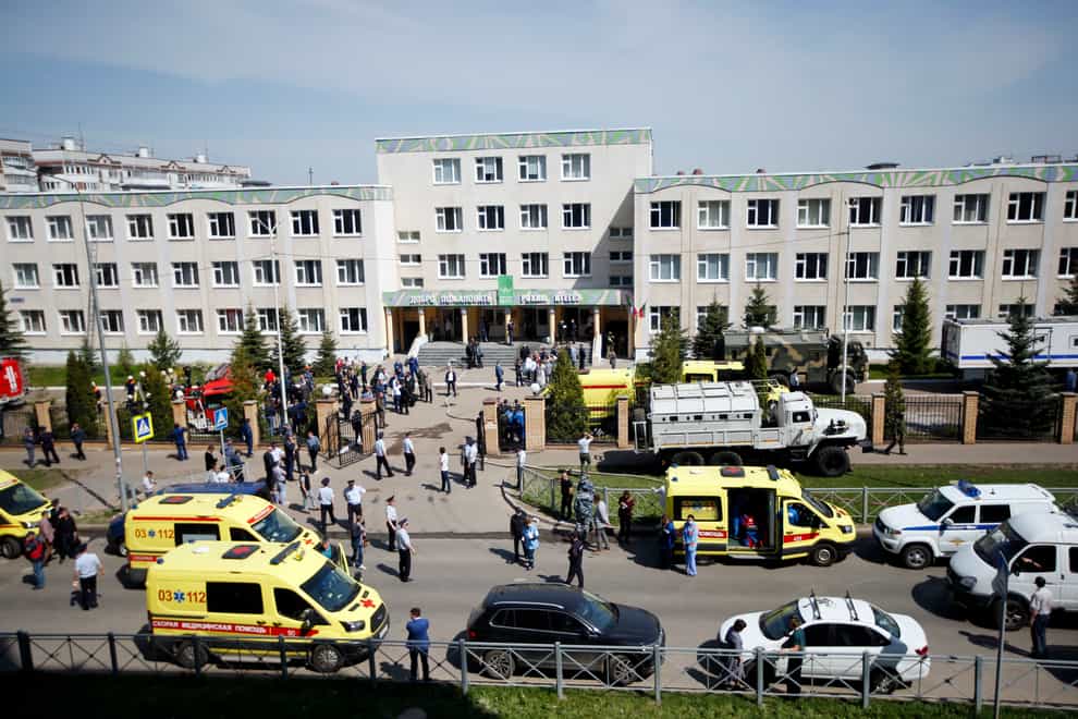 Ambulances and police cars at a school after a shooting in Kazan, Russia