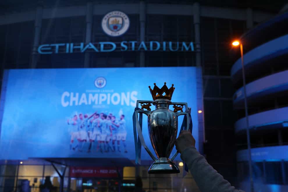 Manchester City fans celebrate the club's Premier League triumph at the Etihad Stadium