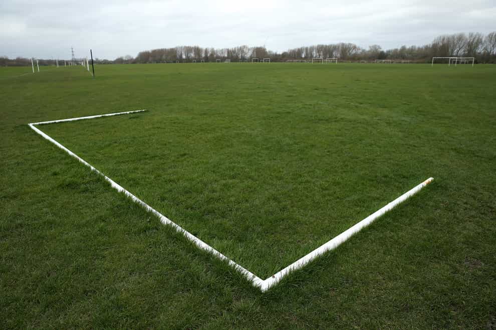 Goalposts lie on a football pitch